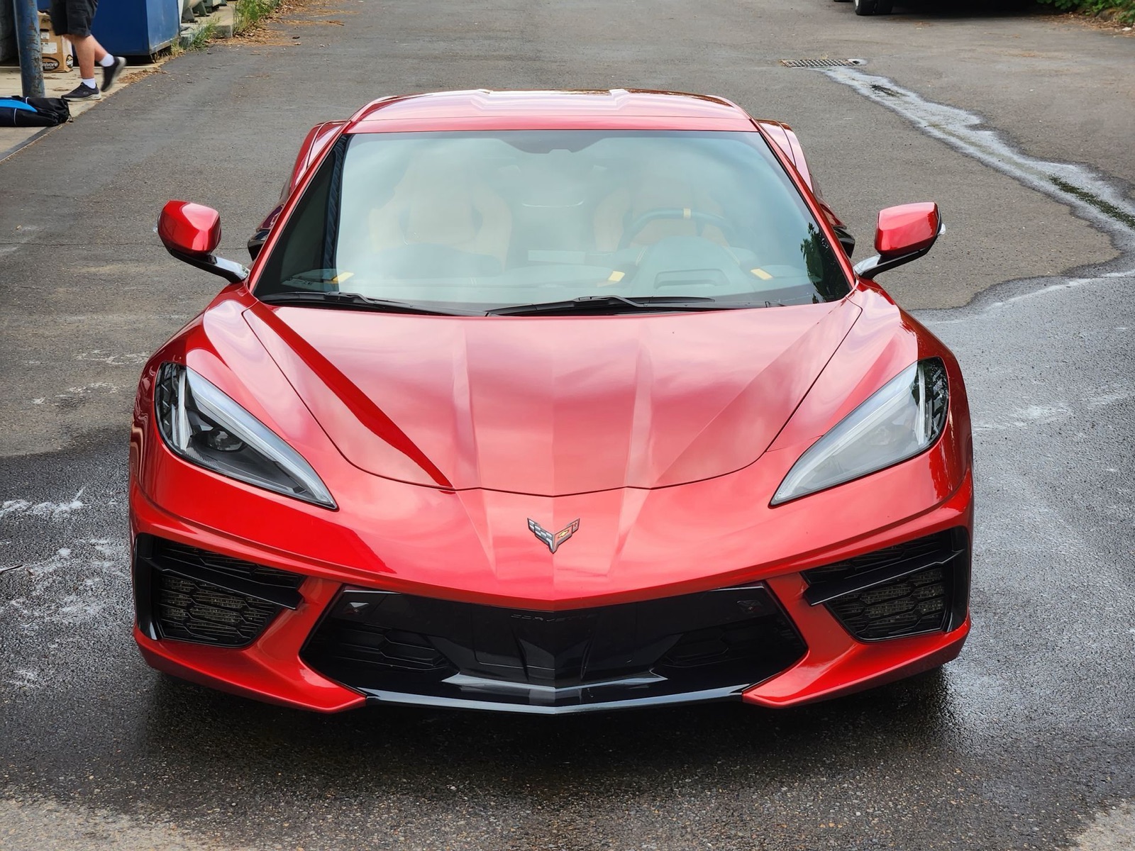 A red sports car protected with a ceramic coating.